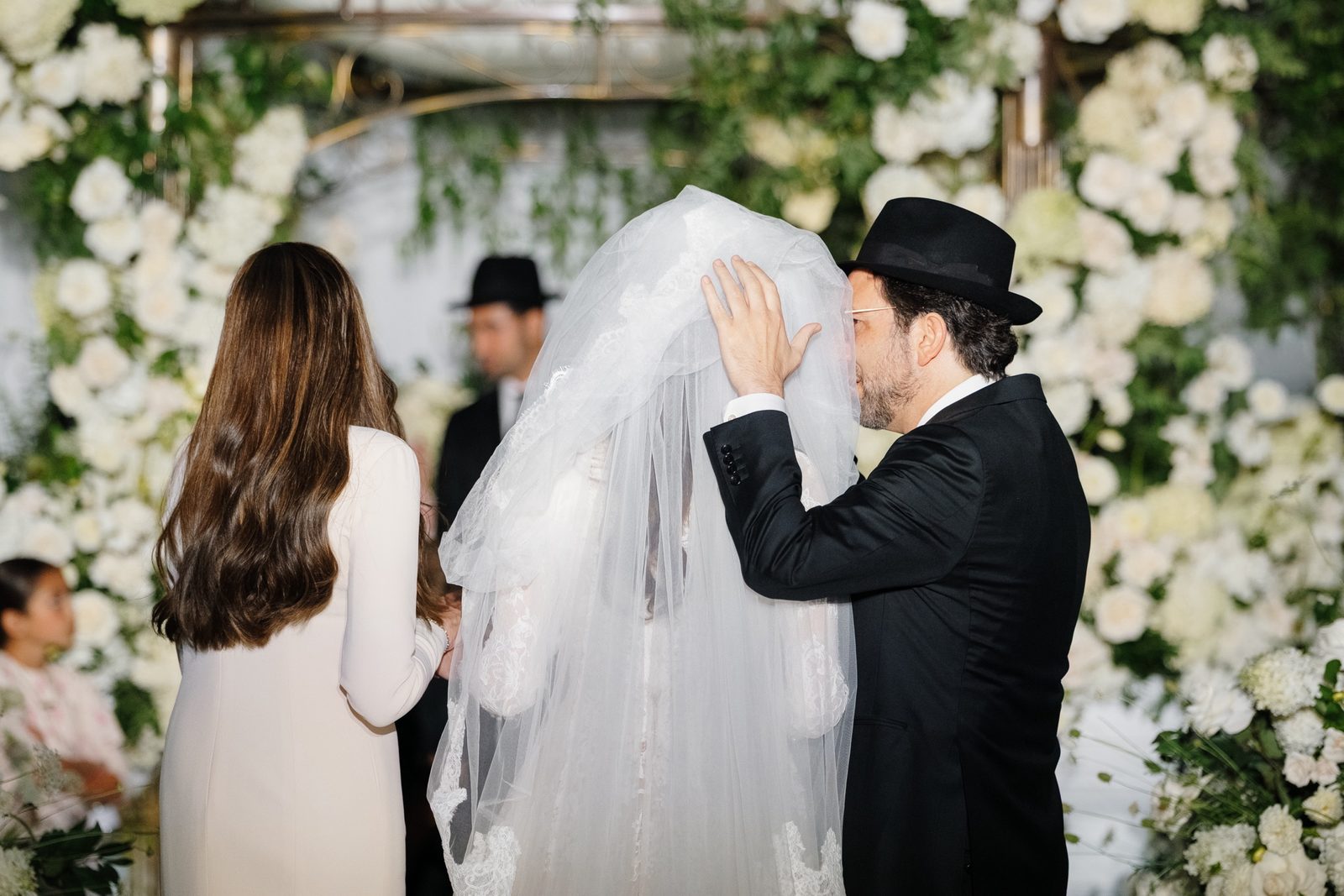David lowering Adina’s veil