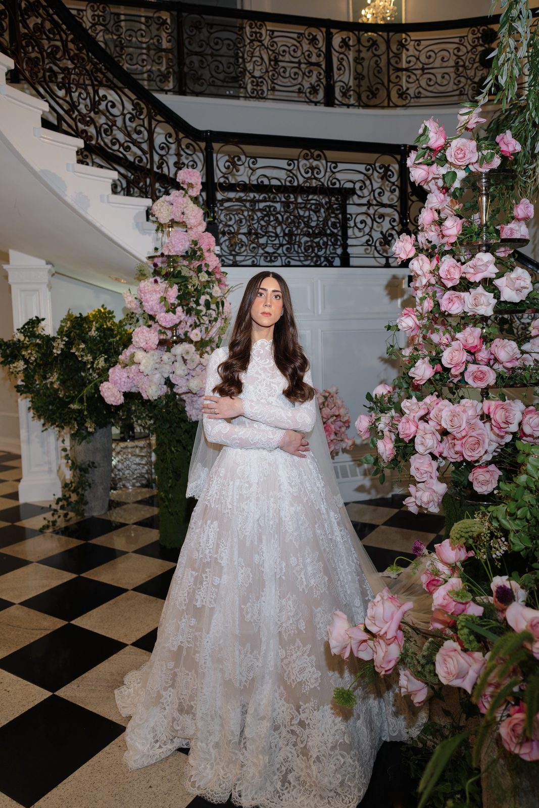 Adina beside pink hydrangeas at the foot of the staircase