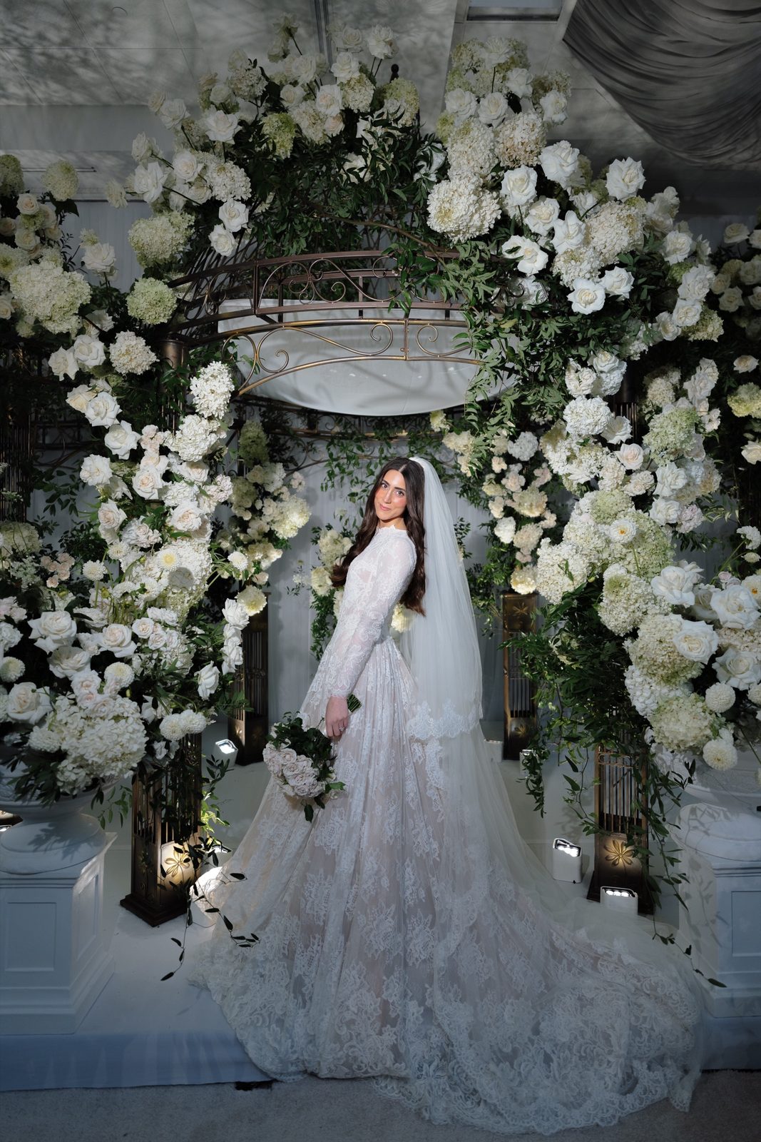 Adina beneath the white rose arch