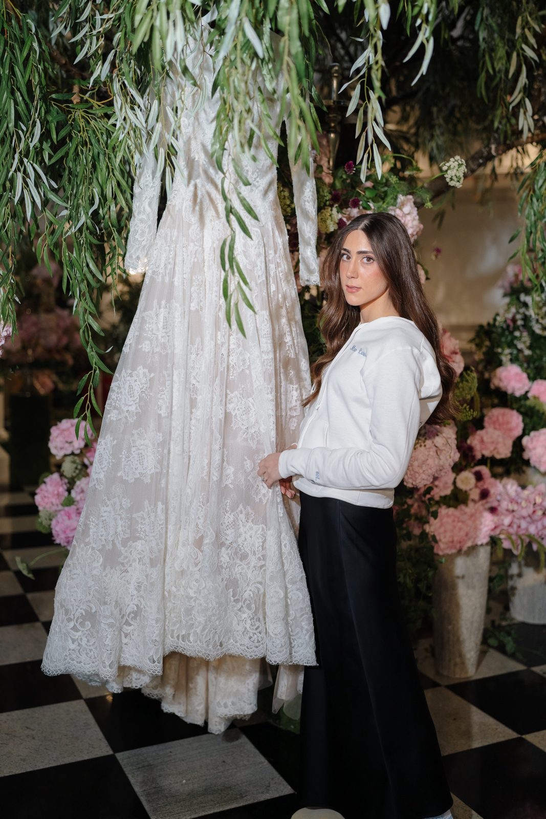 Adina with her gown under the willow installation in the foyer