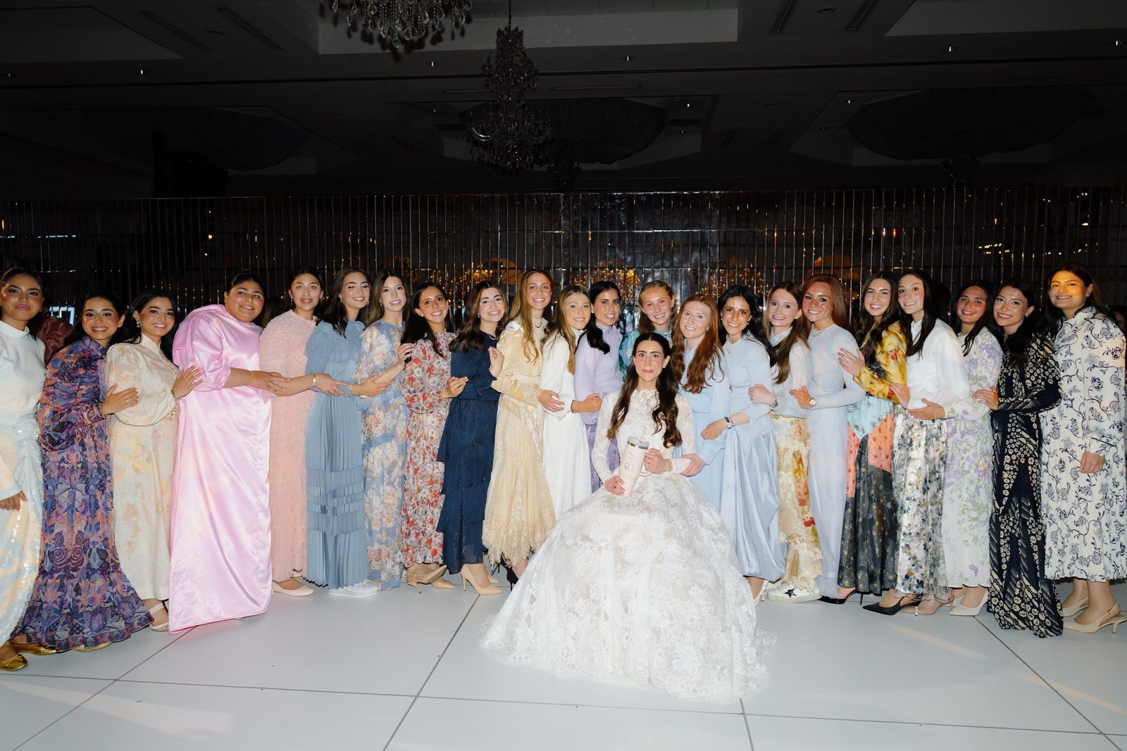 A circle of guests around Adina on the dance floor