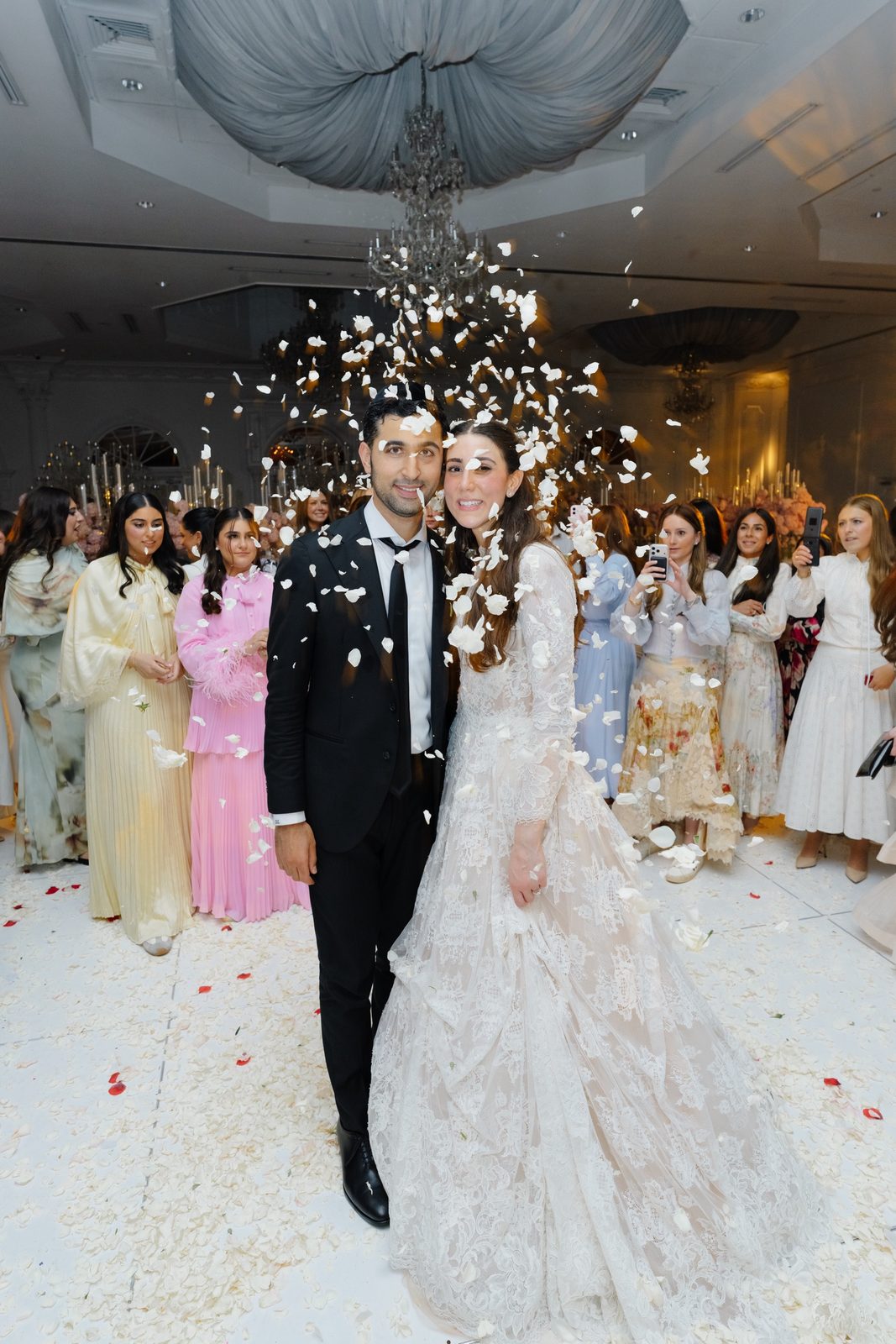 Adina and David under falling confetti