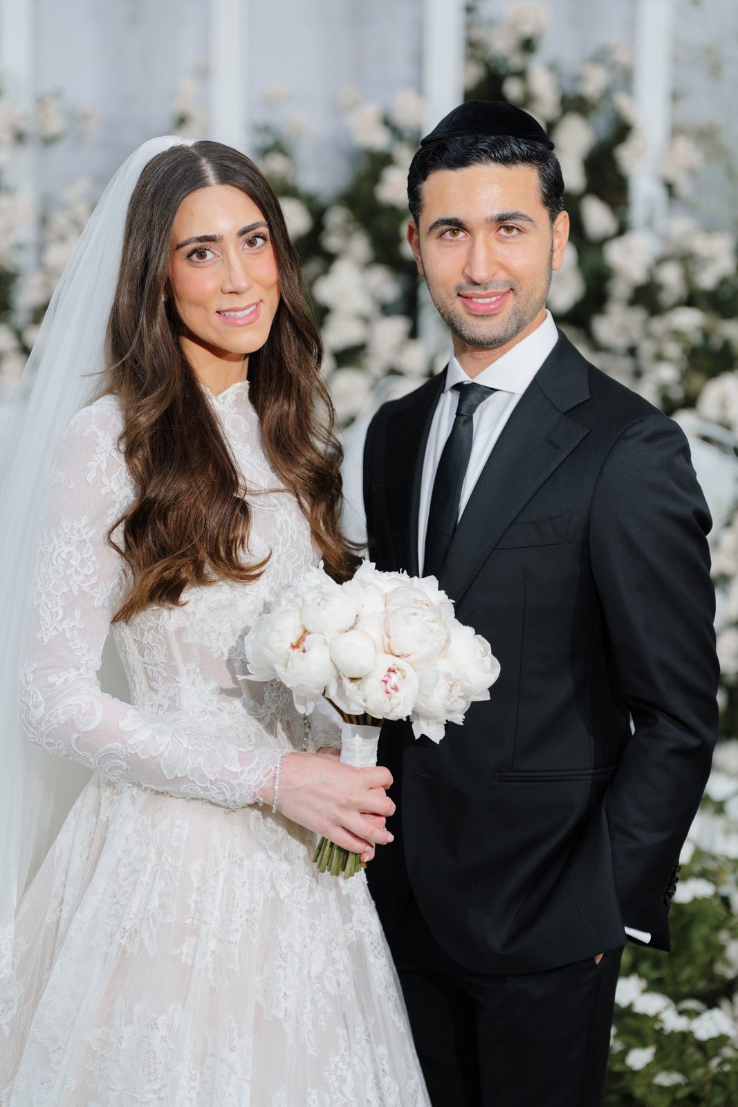 Adina and David with white roses