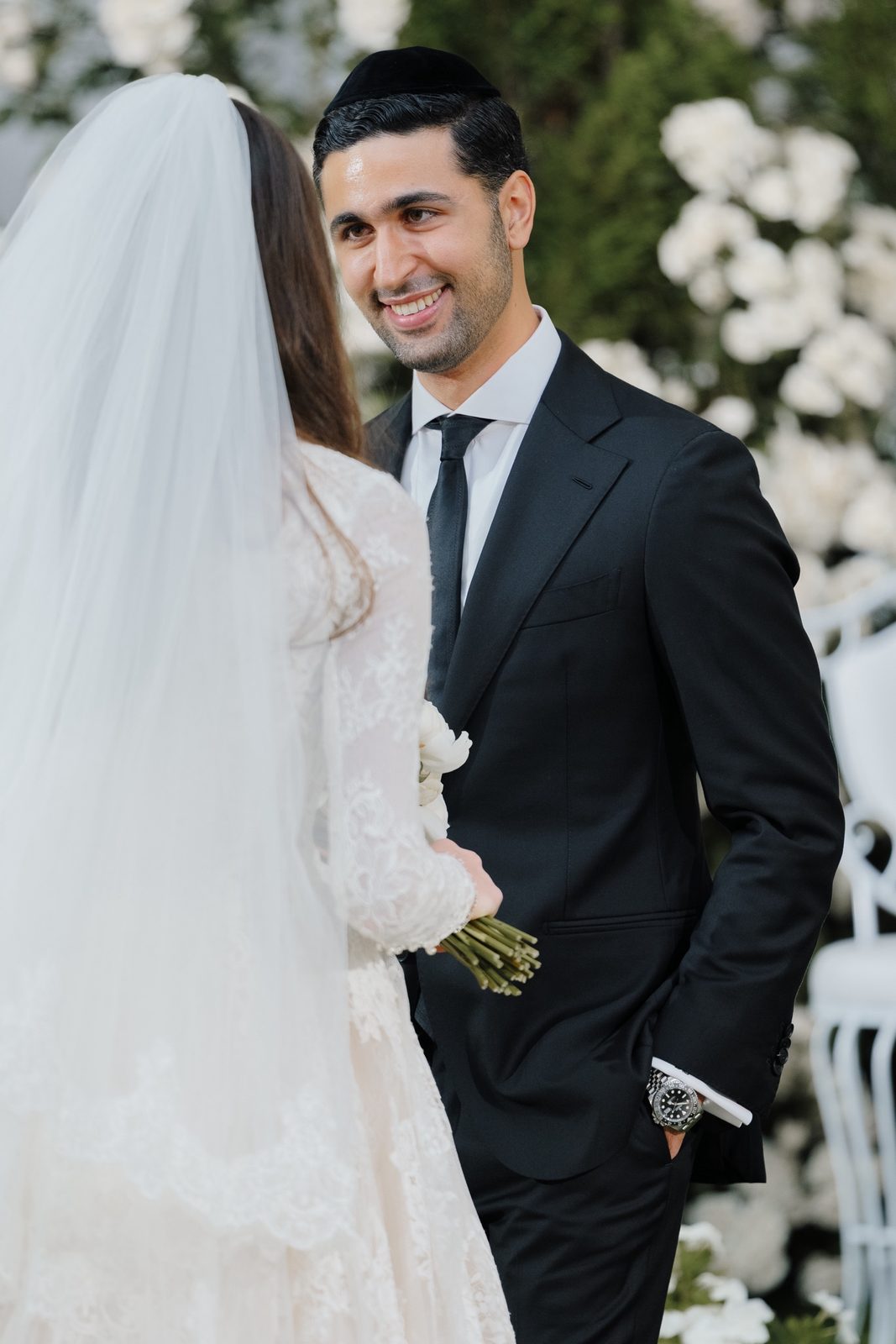 David smiling at Adina during the first look
