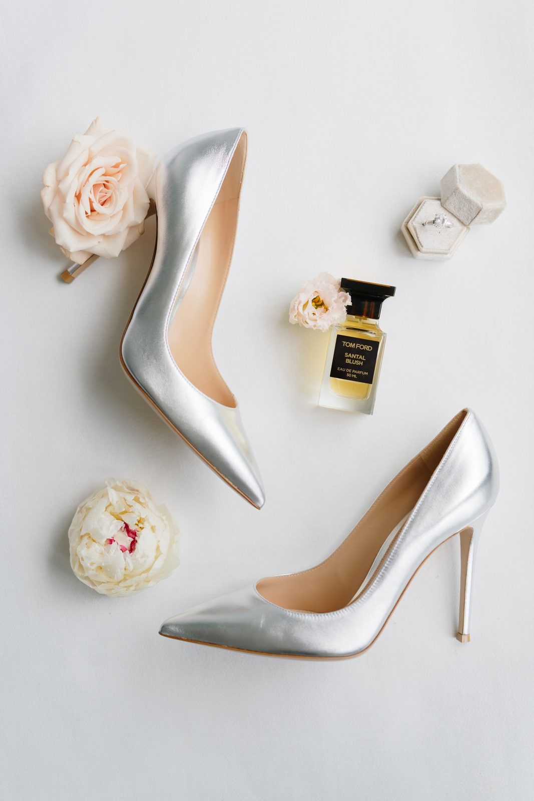 Adina’s silver heels and perfume