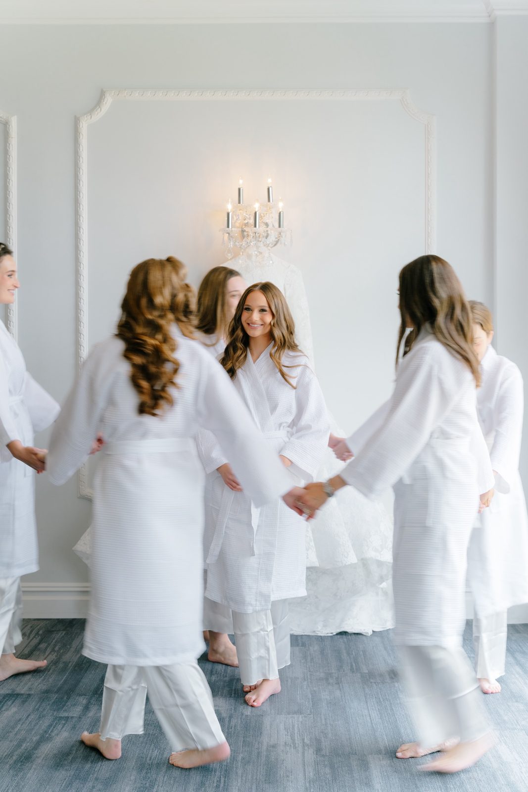 Atara and her friends in white robes getting ready