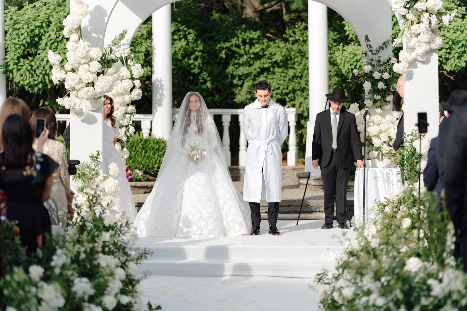 The ceremony under the chuppah in the garden
