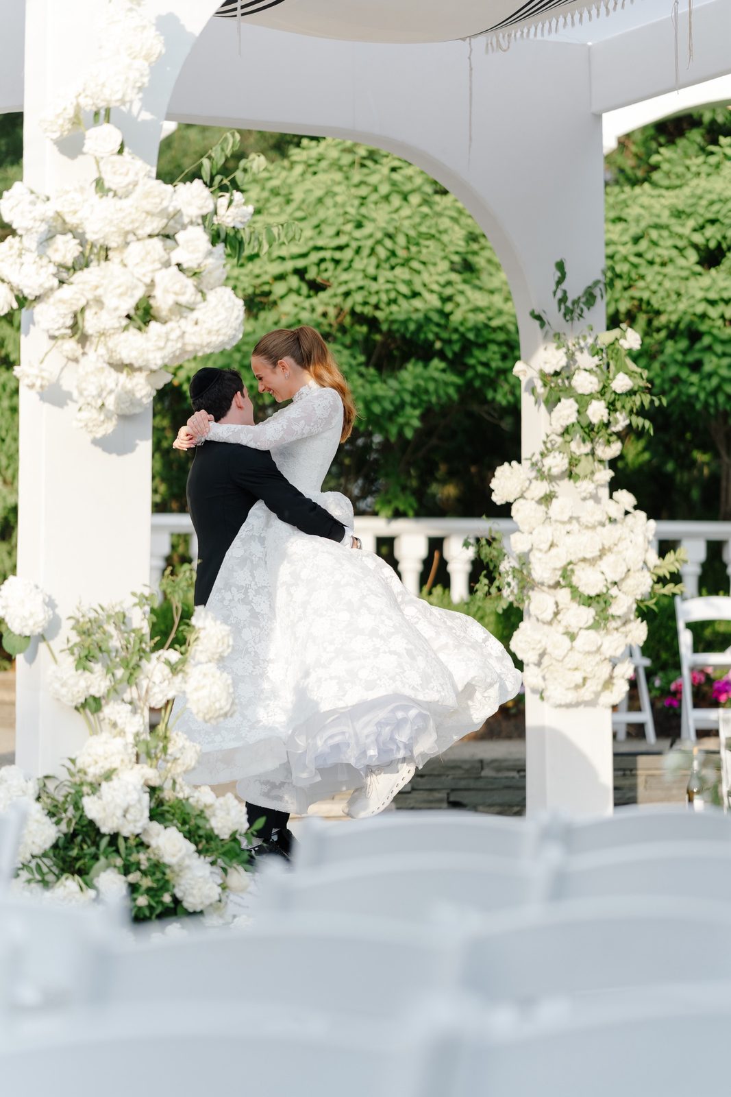 Atara and Ezra dancing under the pergola