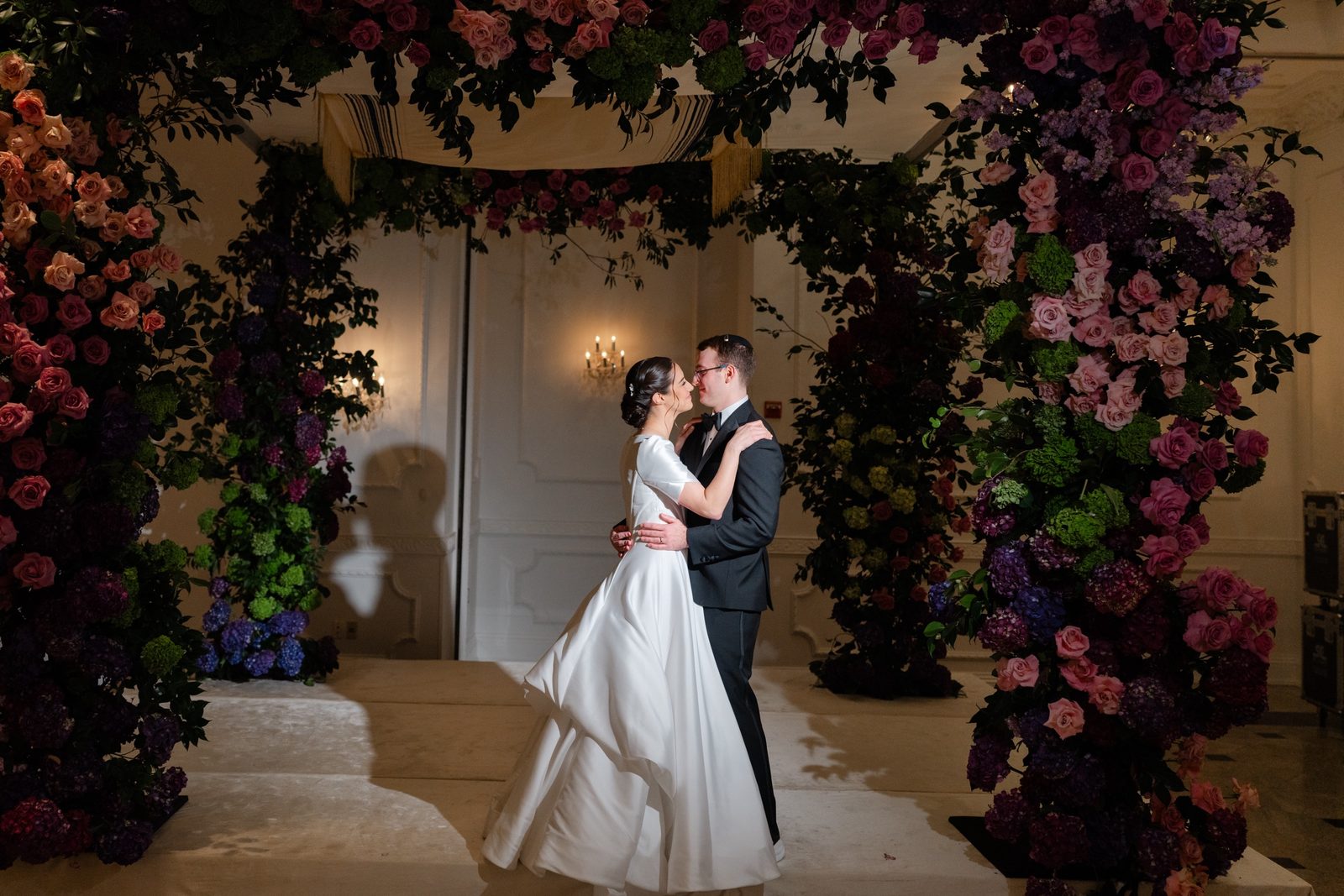 Kayla and Gabriel alone under the chuppah after the ceremony