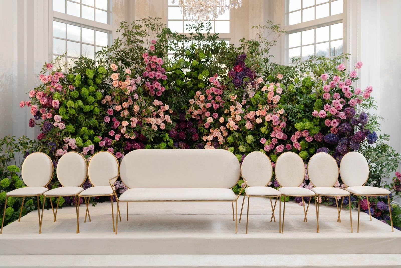 The bridal seating area in pink and purple florals