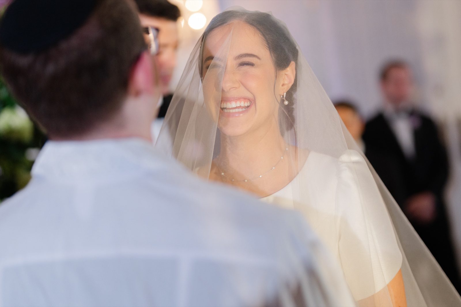 Kayla smiling under her veil