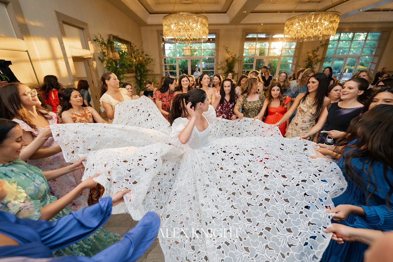 Aline’s lace dress fanned out mid-spin on the dance floor