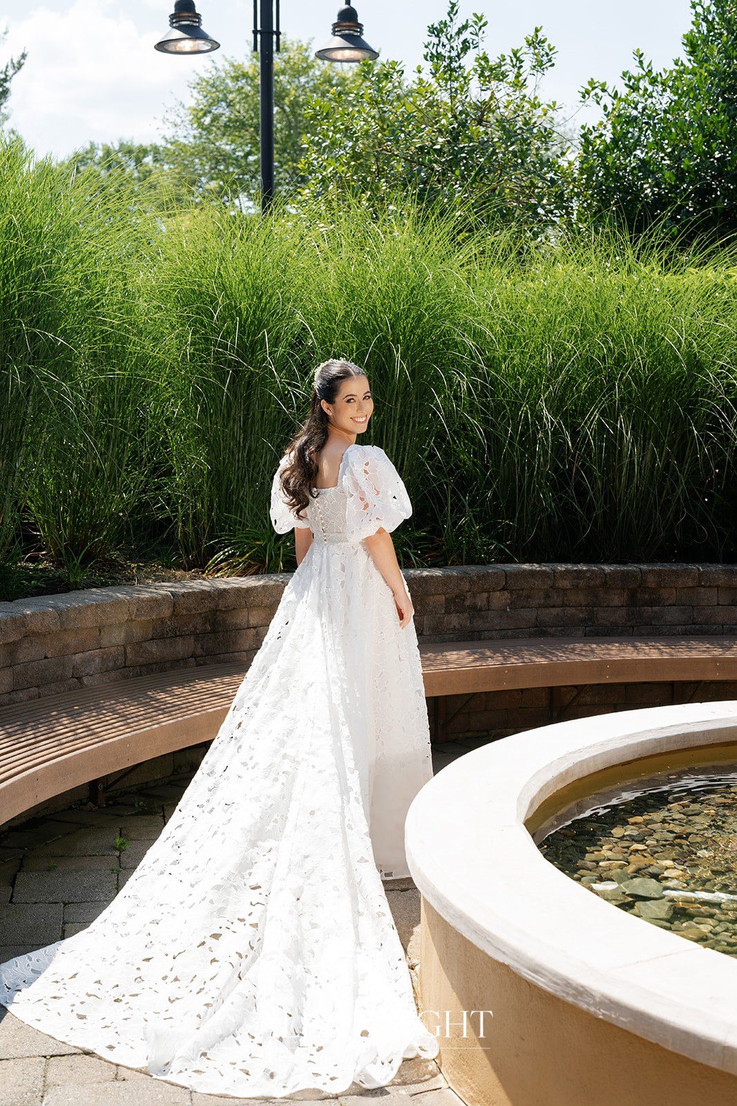 Aline beside the garden fountain at Stone House in Warren, NJ