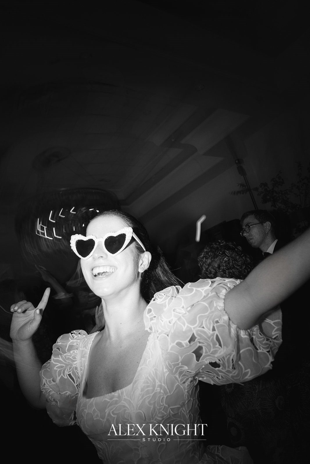Aline in heart-shaped sunglasses on the dance floor