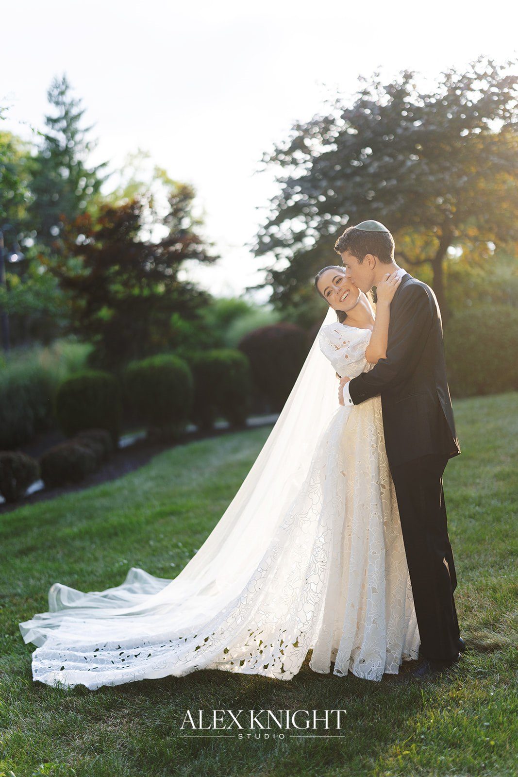 Aline and Tyler at golden hour on the lawn