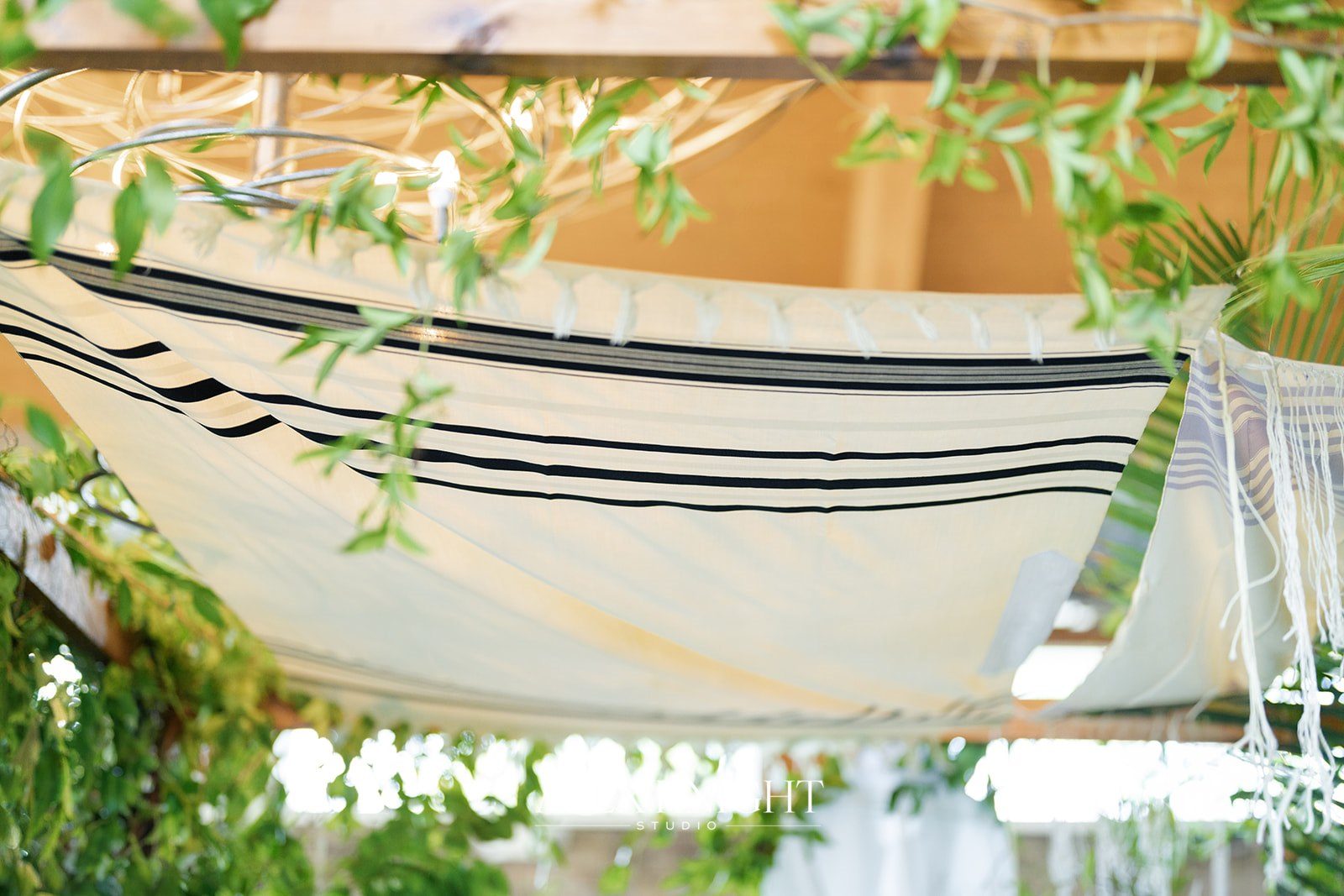 The grandparents’ tallit forming the top of the chuppah