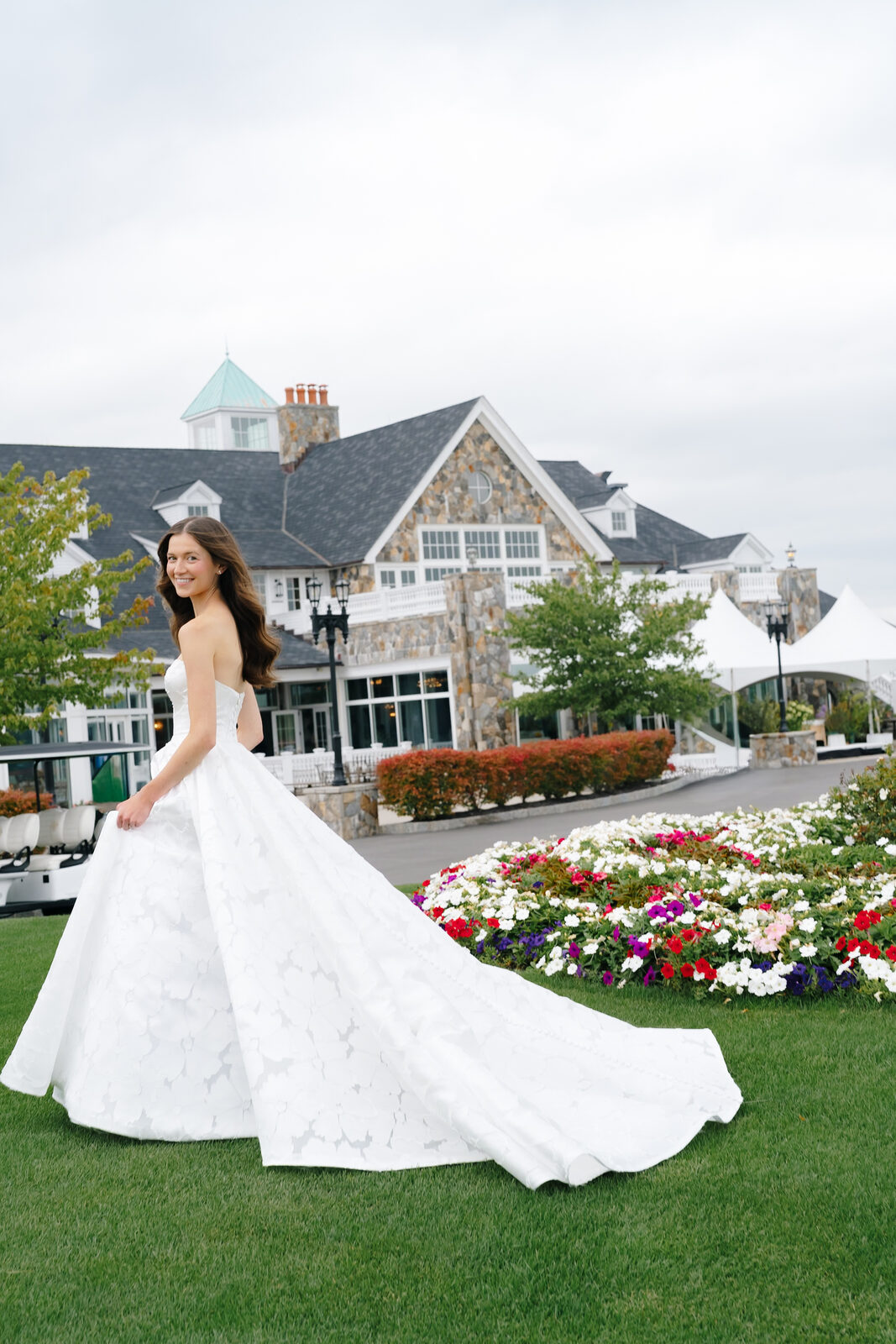 Allie on the lawn in front of the clubhouse at Trump National Westchester