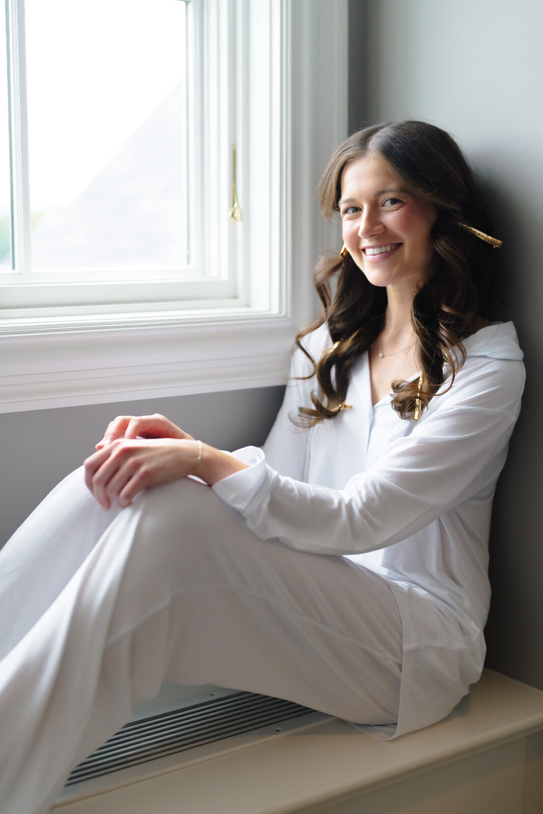 Allie by the window in soft light before getting dressed