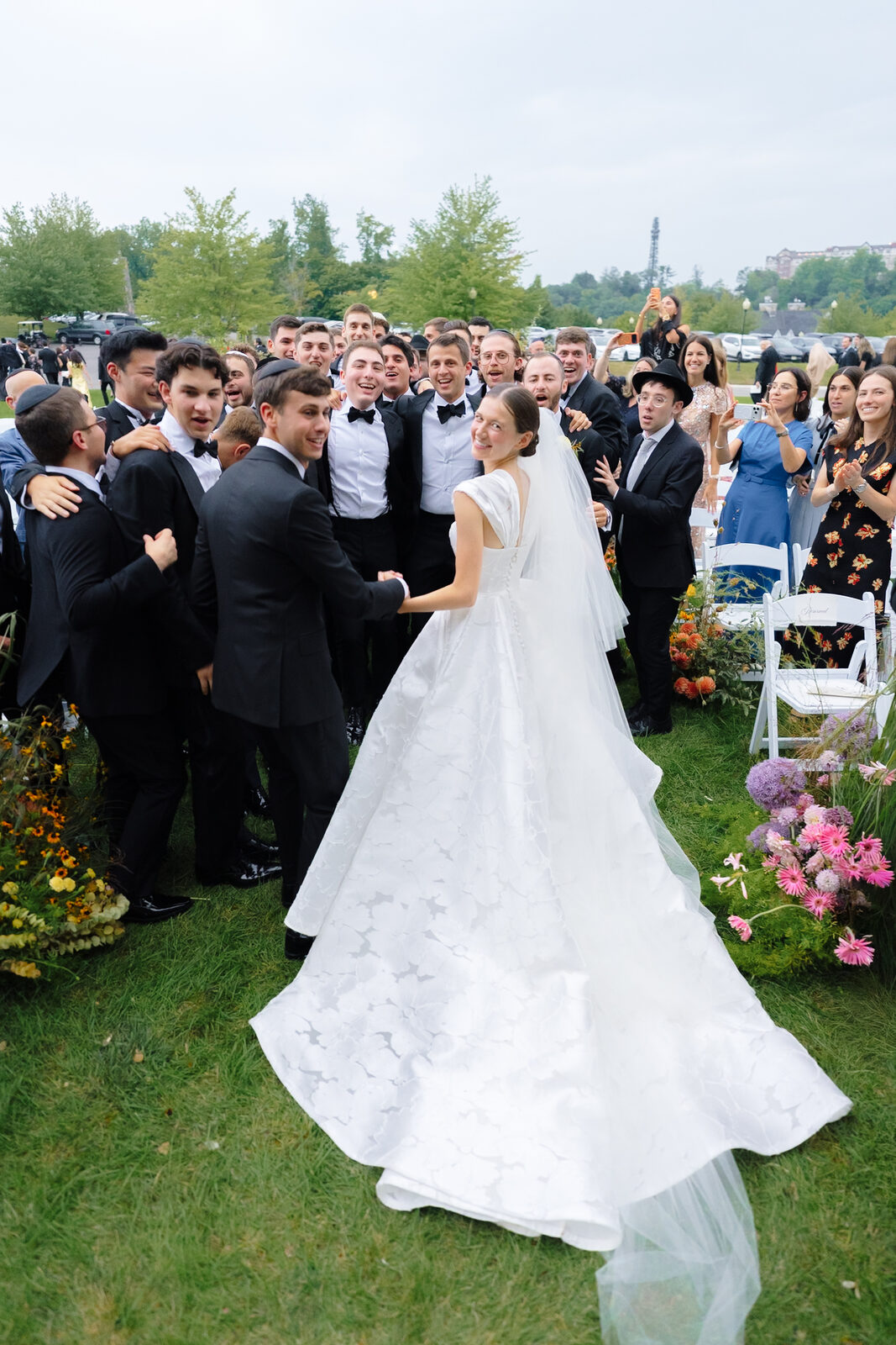 Allie and Charlie surrounded by guests after the ceremony