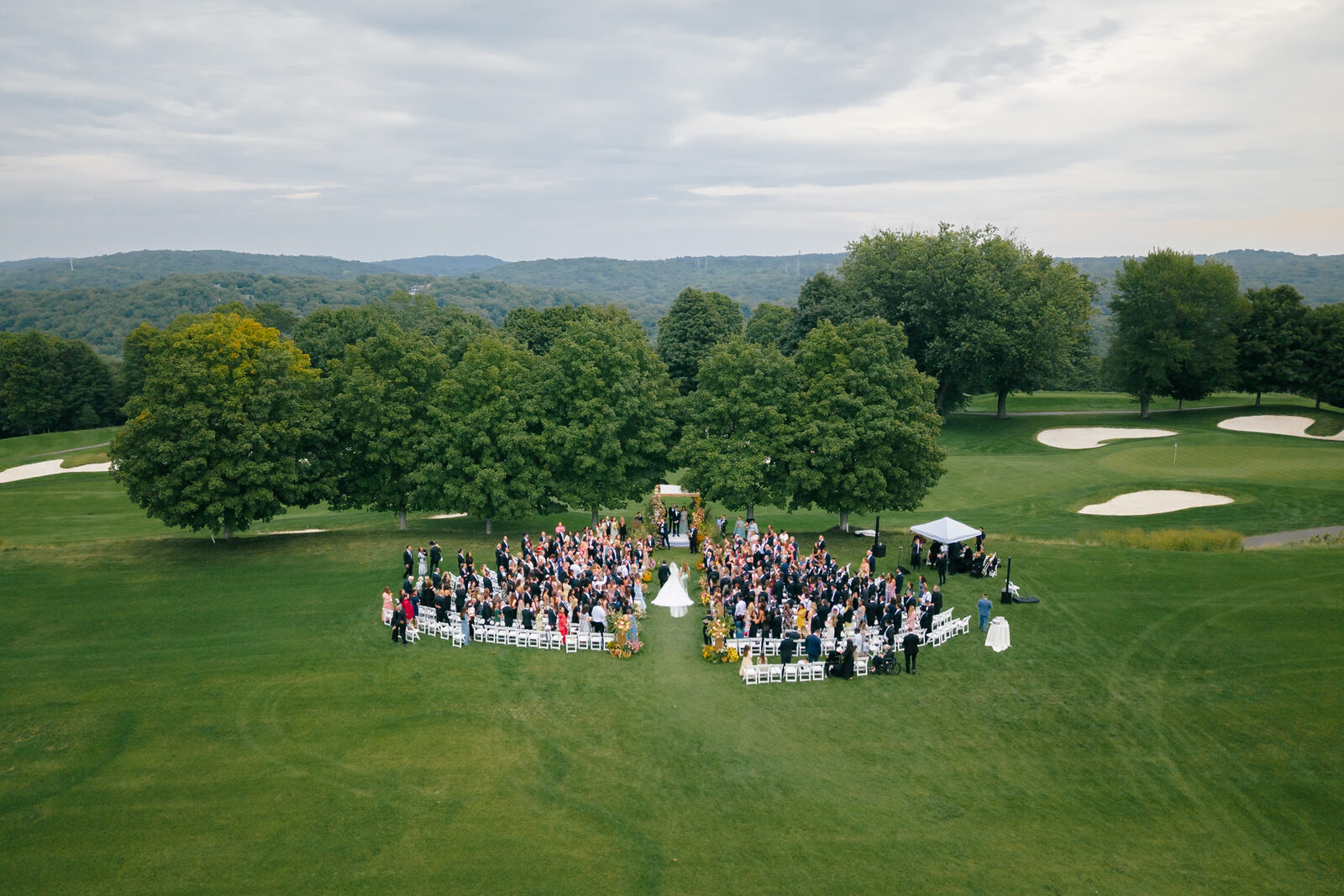 Aerial view of Allie and Charlie's ceremony on the golf course at Trump National Westchester