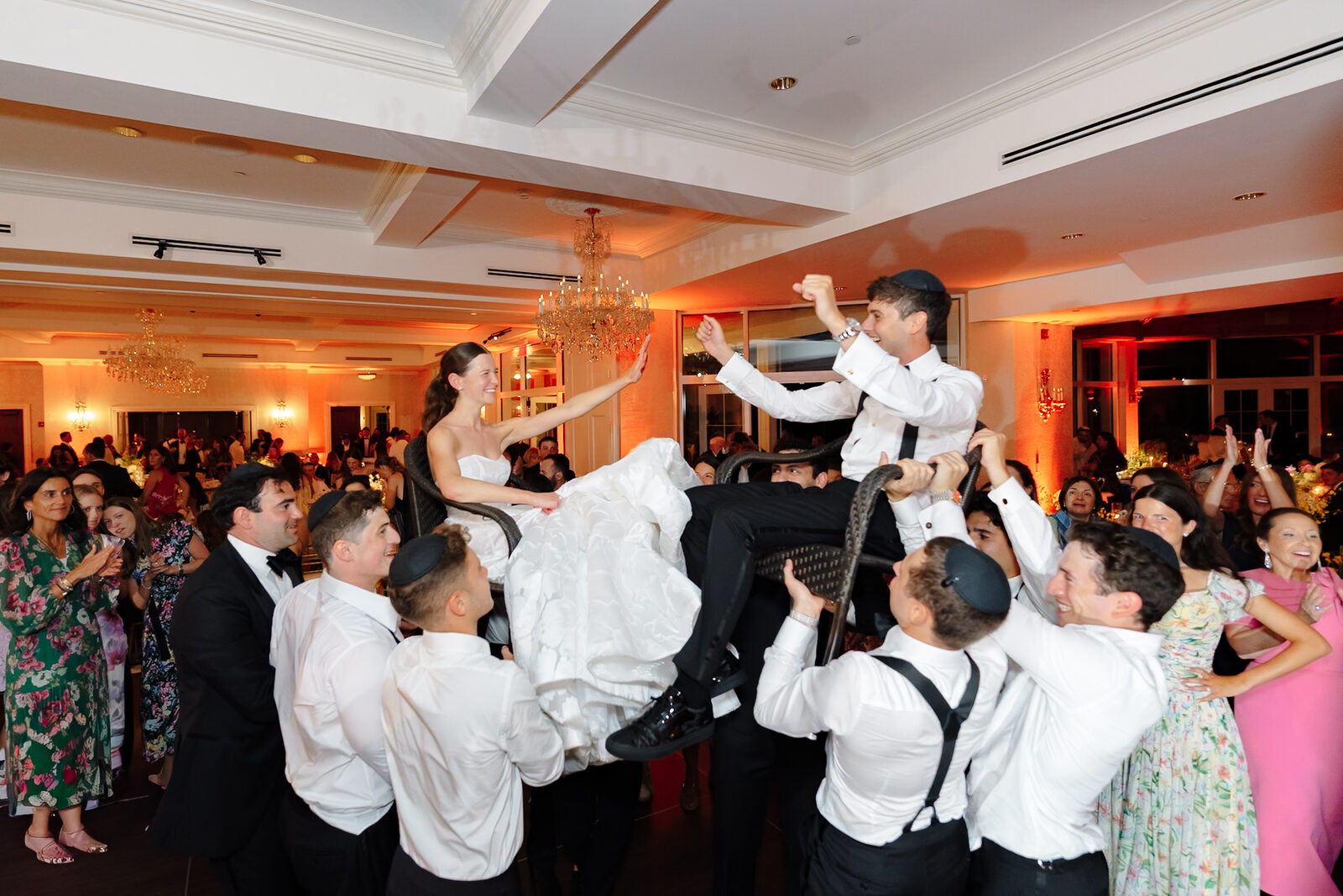 Charlie lifted on a chair during the hora