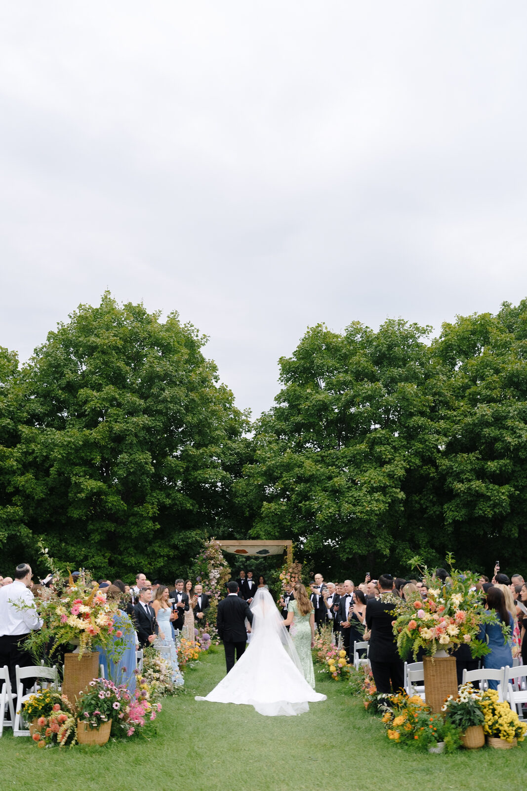 The outdoor ceremony aisle lined with wildflowers at Trump National Westchester