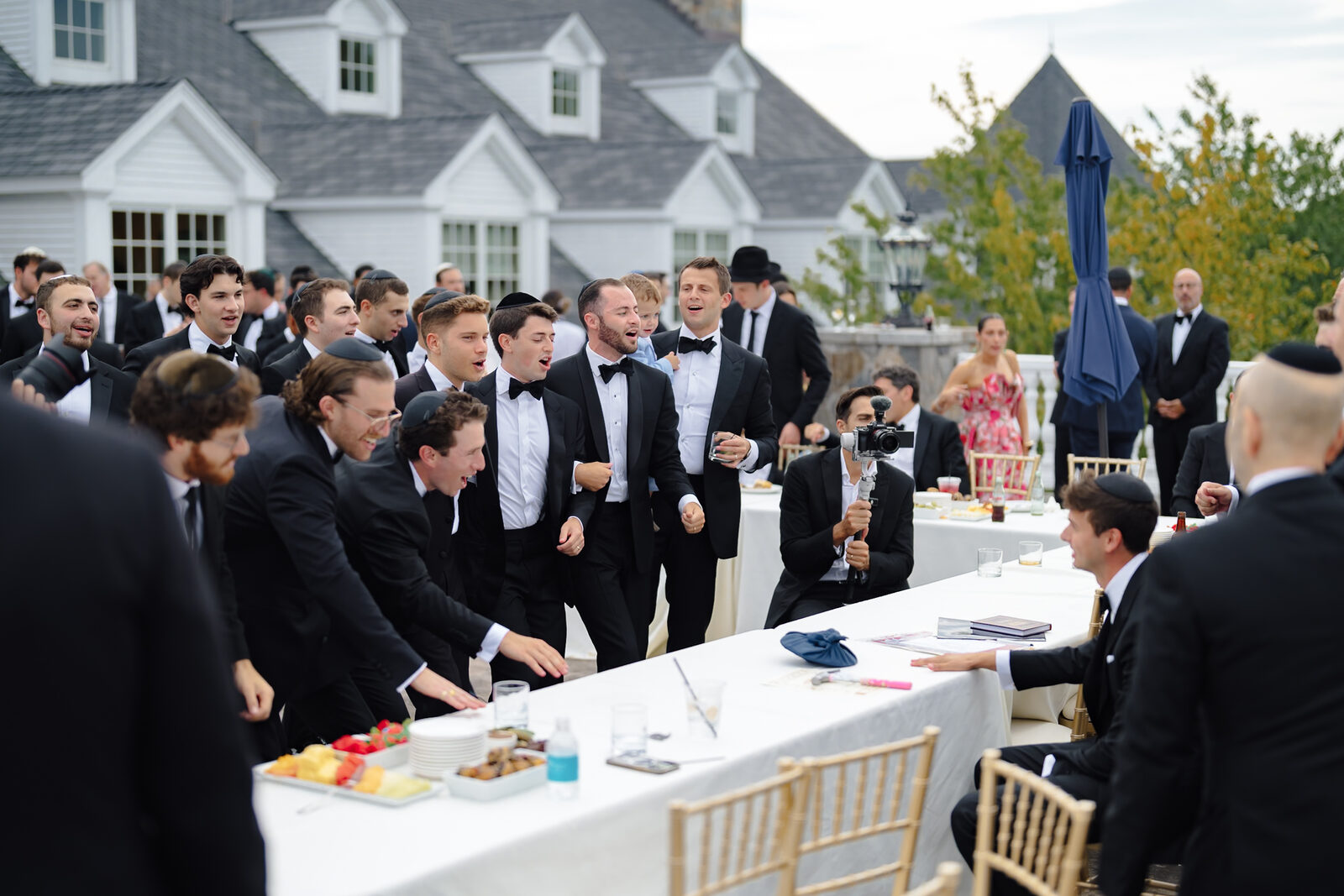 Charlie at the tisch on the terrace at Trump National Westchester, surrounded by the men