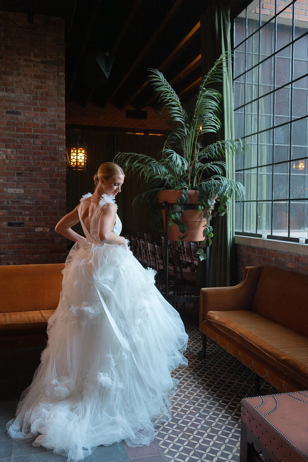 Ashley’s tulle train fills the floor of the hotel lounge