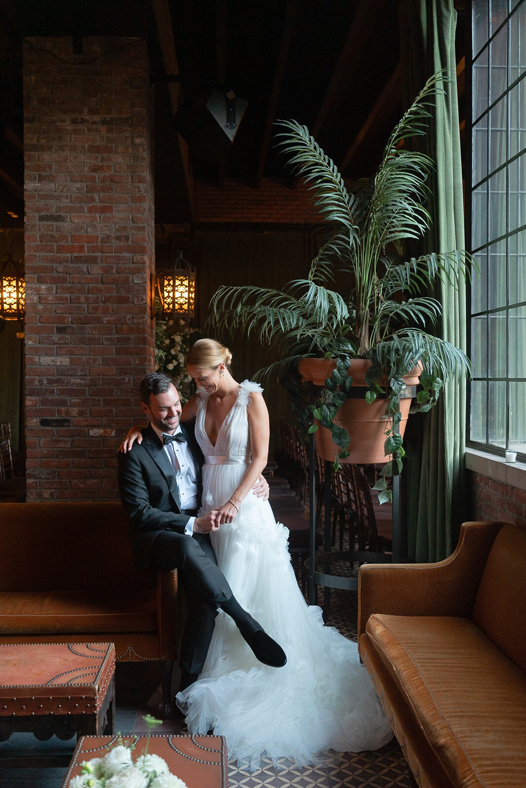 Ashley and Kendall sit together in the green-windowed lounge of The Bowery Hotel