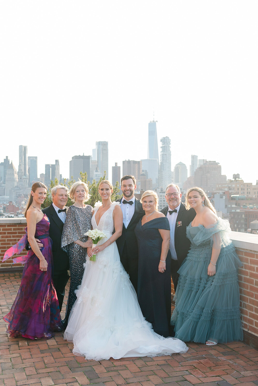 Ashley and Kendall with their bridal party on the rooftop terrace