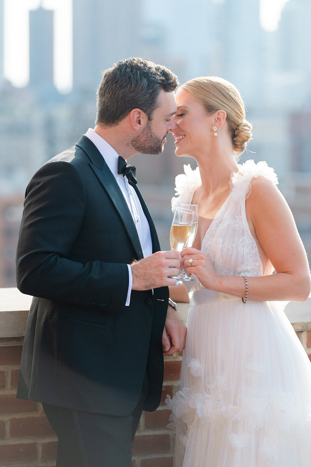 Ashley and Kendall share a kiss and champagne on the terrace above the city