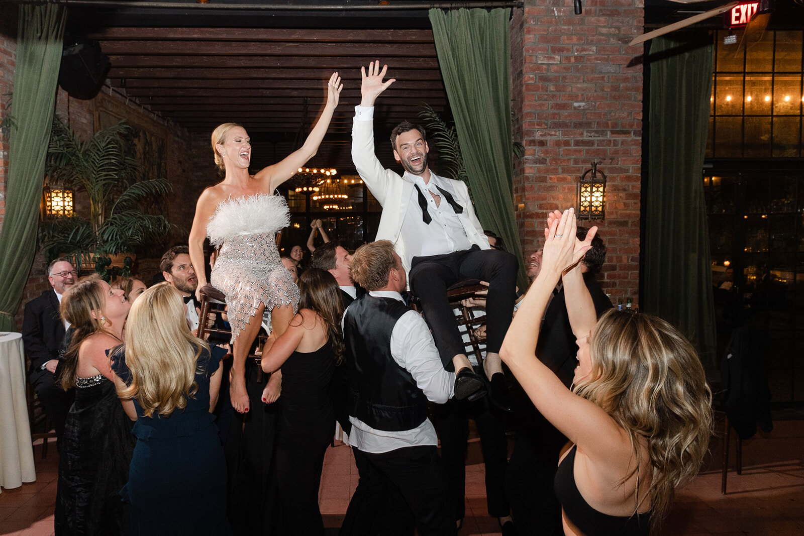 Kendall is lifted above the crowd on the dance floor