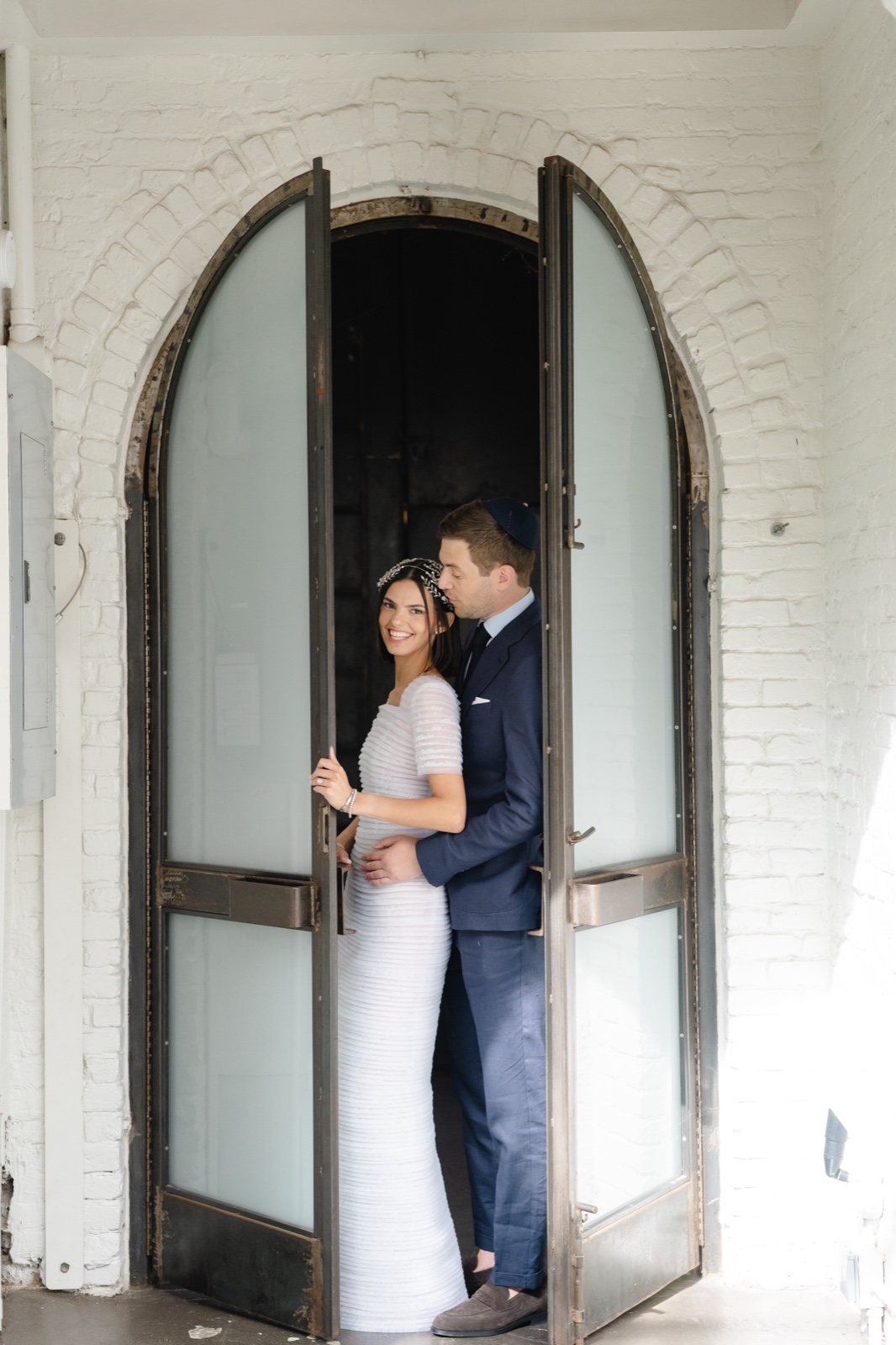 In the arched doorway