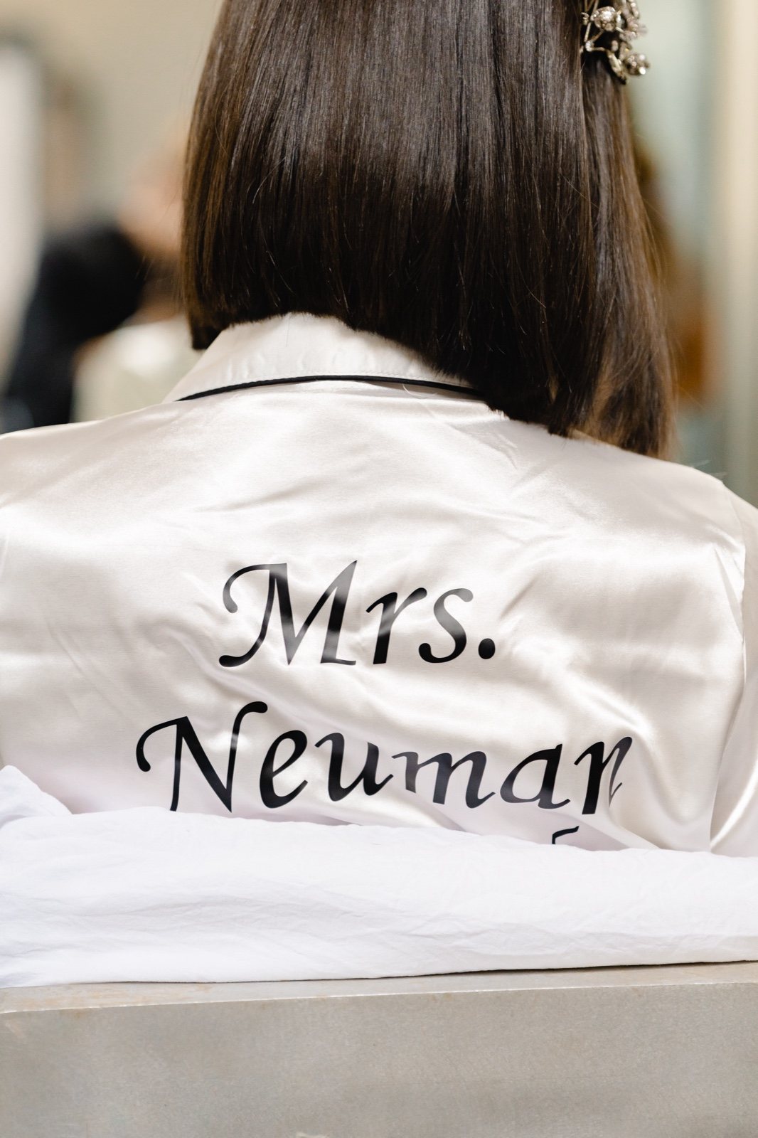 Mrs. Neuman, on the back of her pajamas
