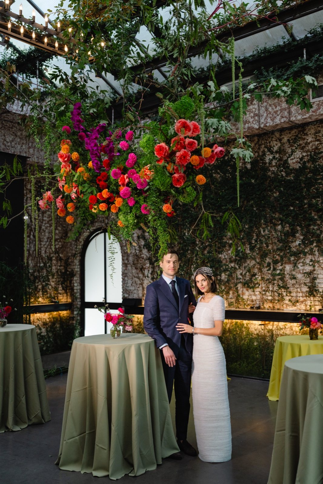 Under the hanging flower installation