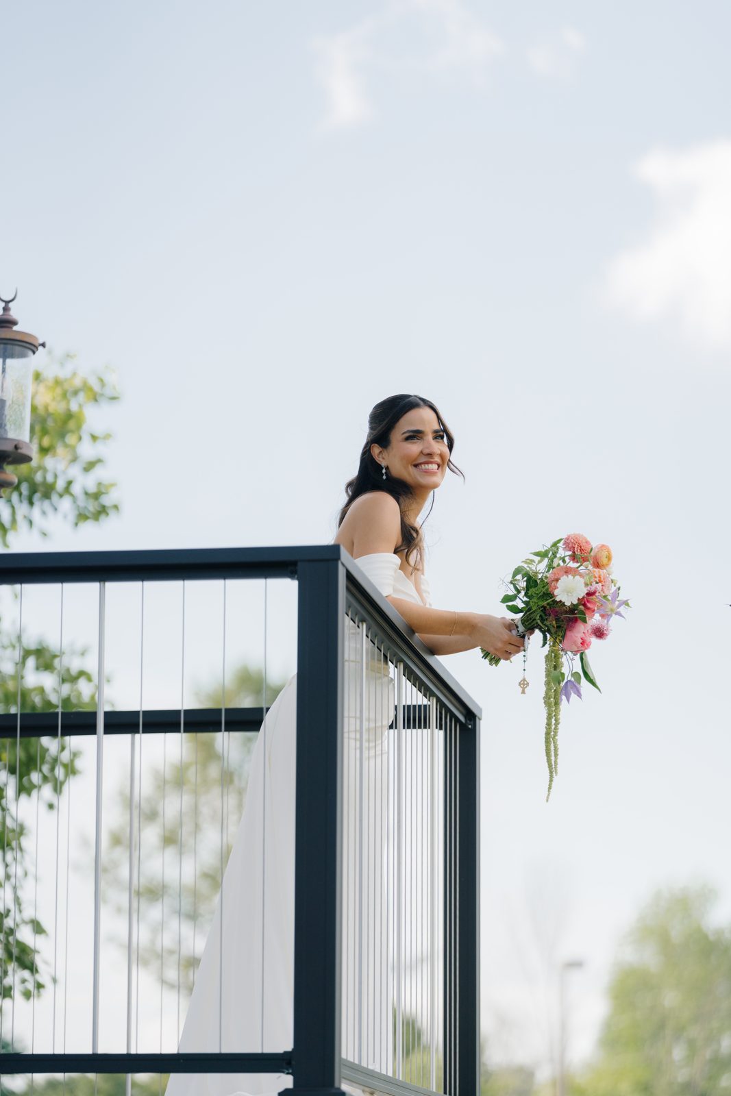 Dharma on the balcony with her bouquet