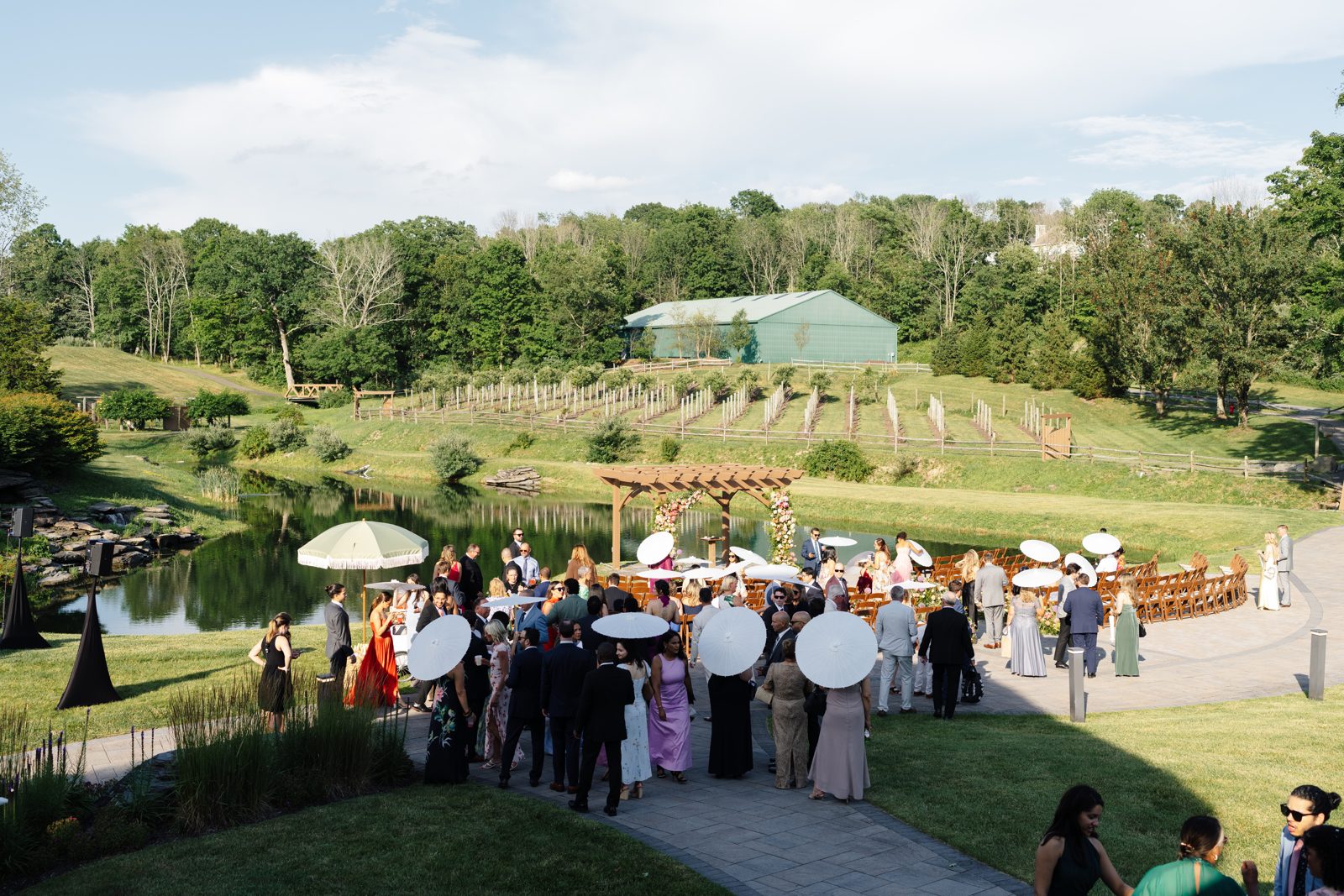 The outdoor ceremony at Bear Brook Valley, guests gathered on the hilltop