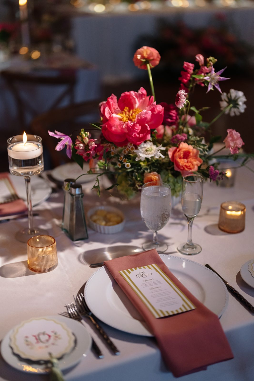 A detail from Dharma and Casey&rsquo;s colorful summer wedding at Bear Brook Valley