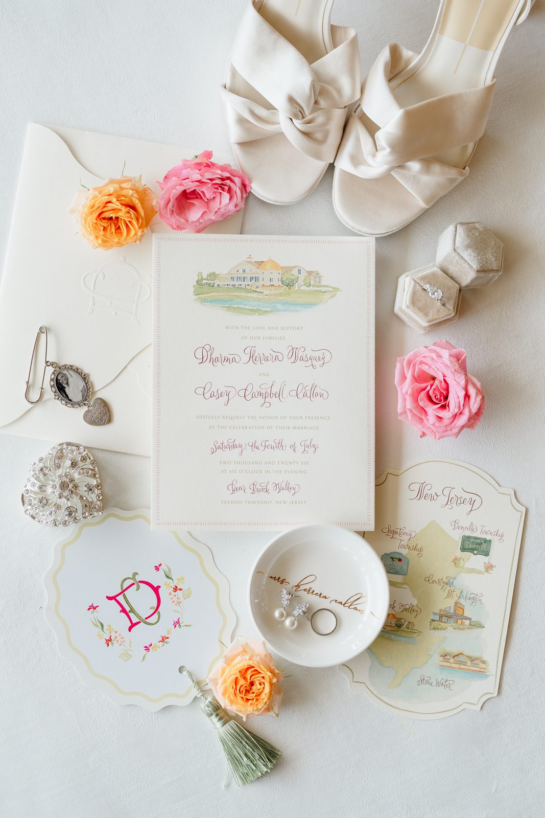 The invitation suite styled with coral garden roses