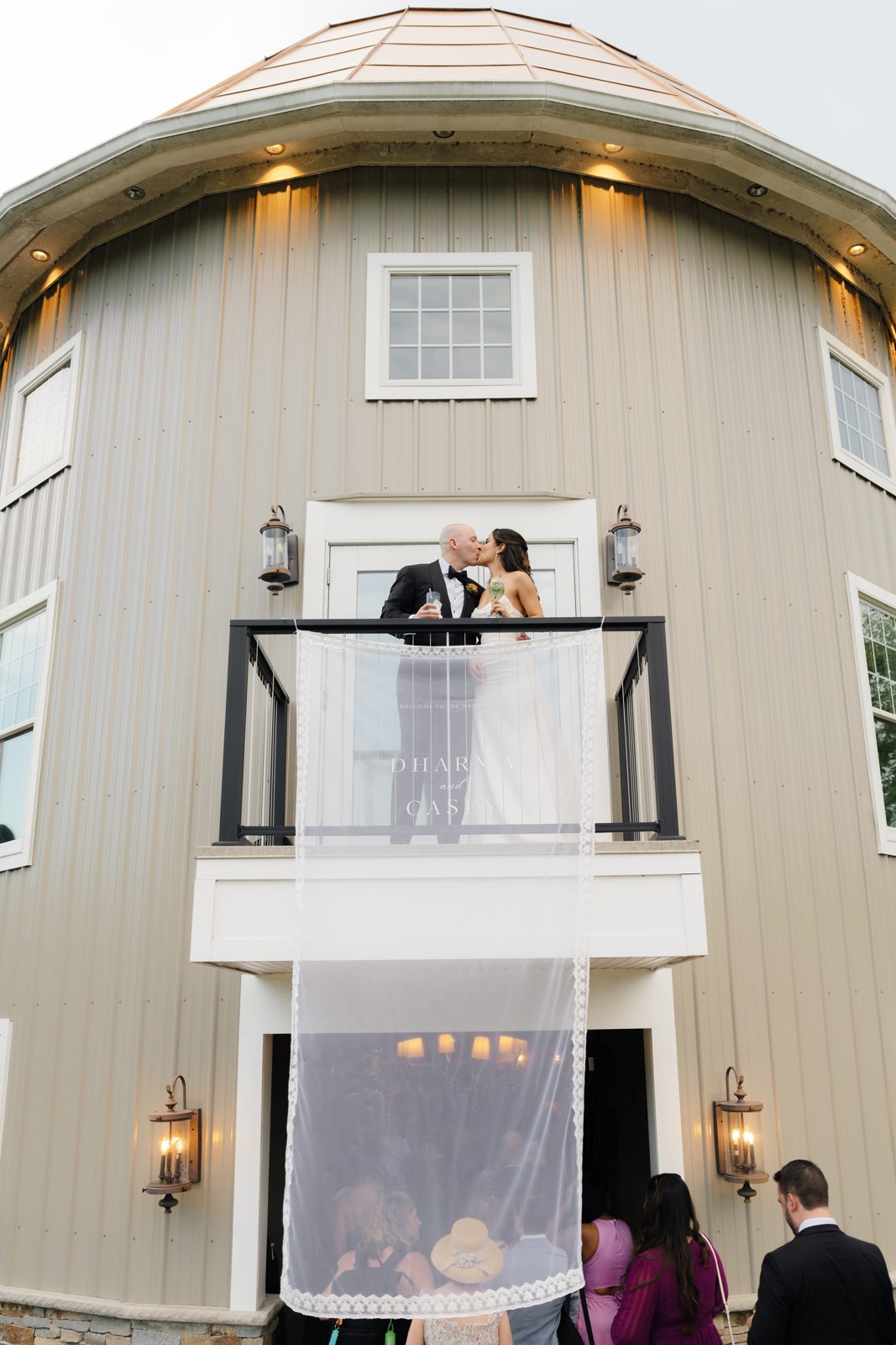 Dharma and Casey on the silo balcony above cocktail hour at Bear Brook Valley