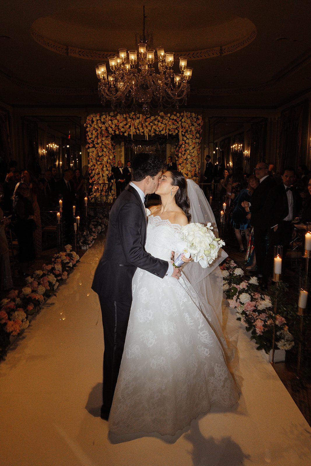 Dori and Ben kiss in the aisle after the ceremony