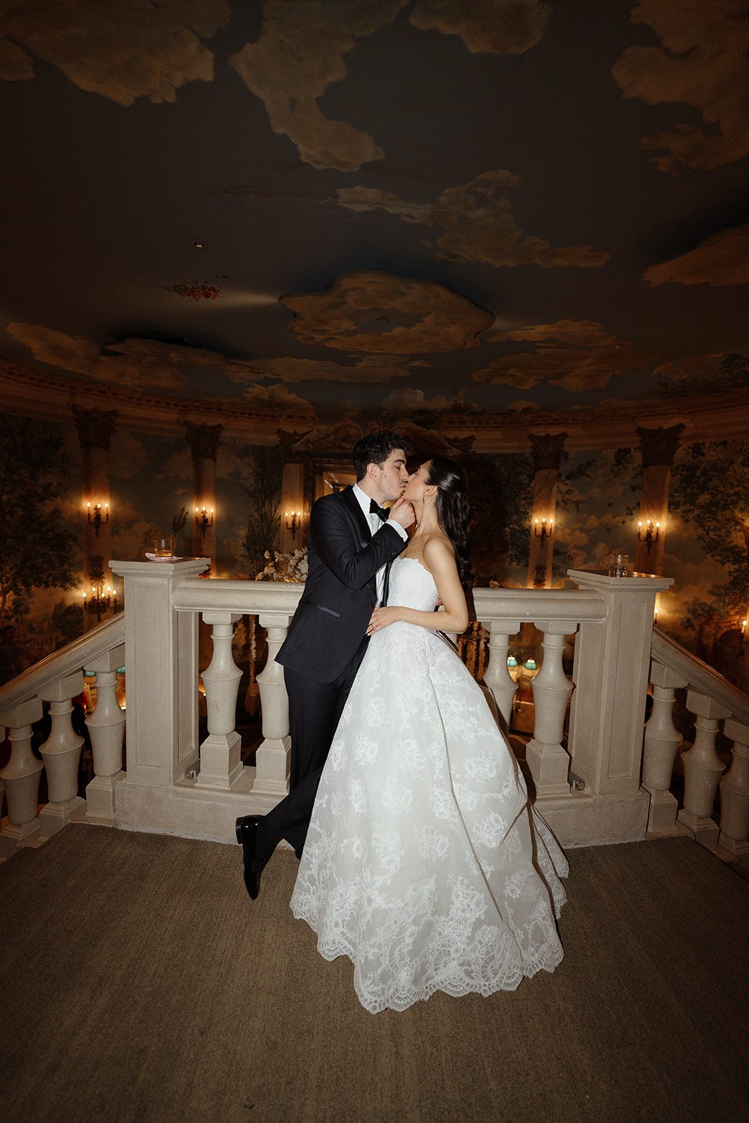 Dori and Ben on the balcony under the painted ceiling