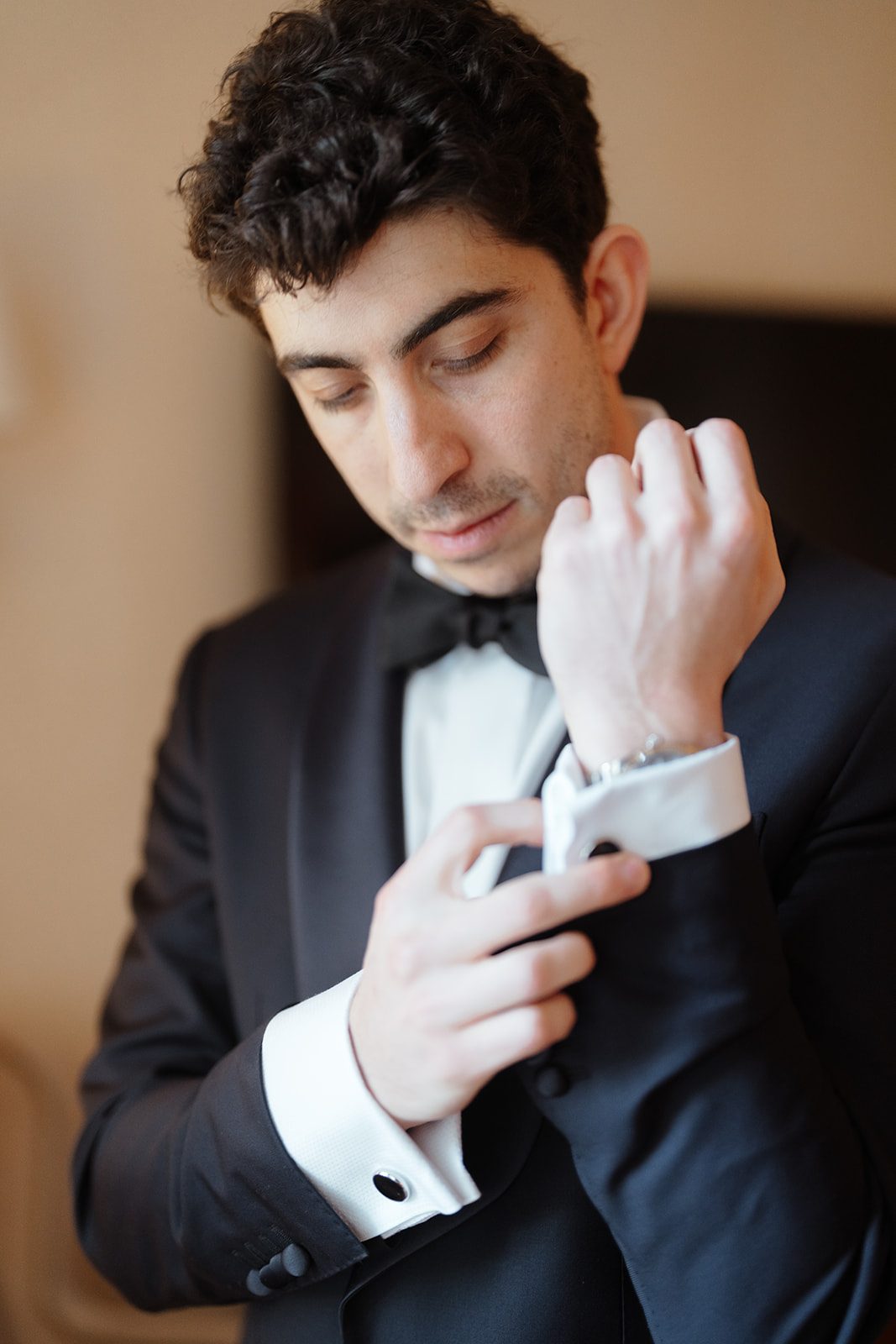 Ben fastening his cufflinks