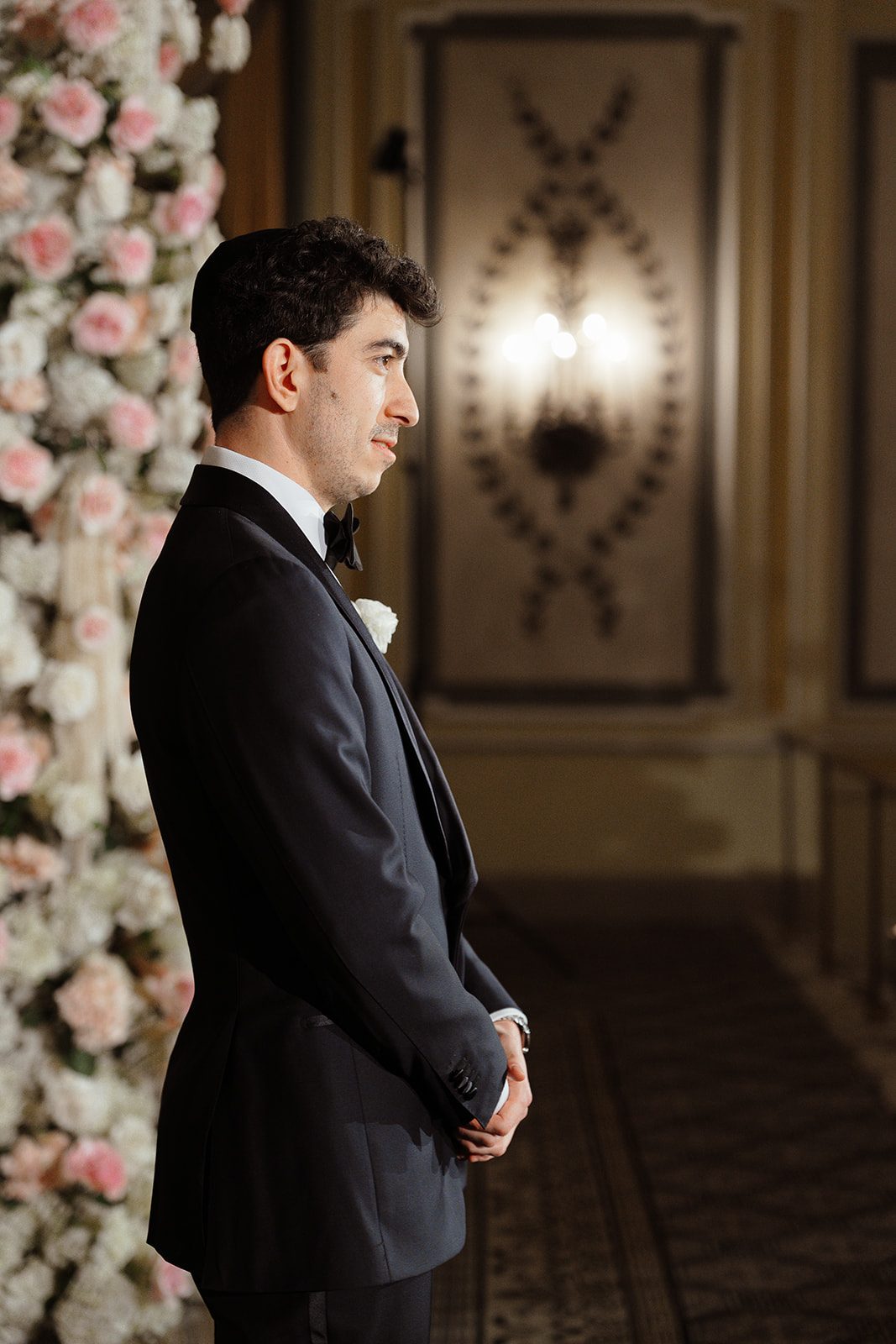 Ben waiting under the rose chuppah