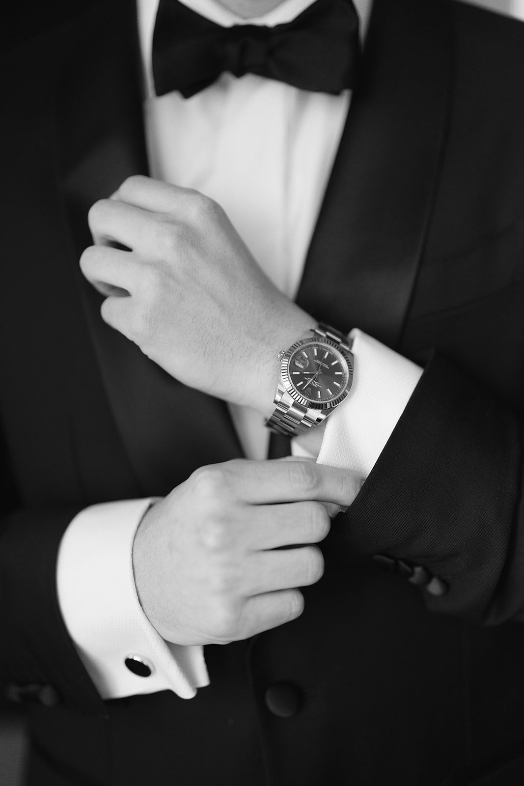 A detail of Ben&rsquo;s watch and cufflinks