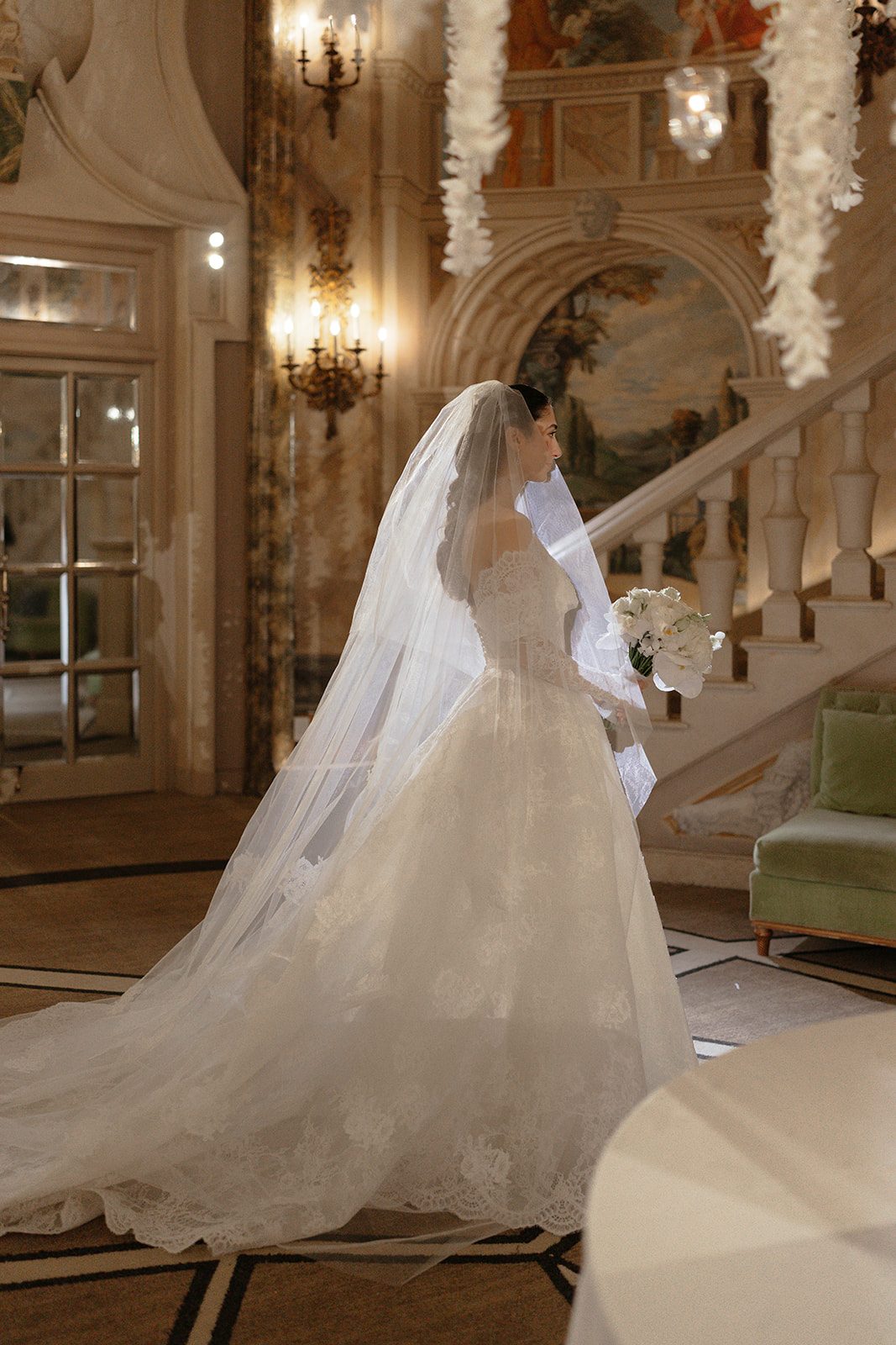 Dori walking with her cathedral veil at The Pierre