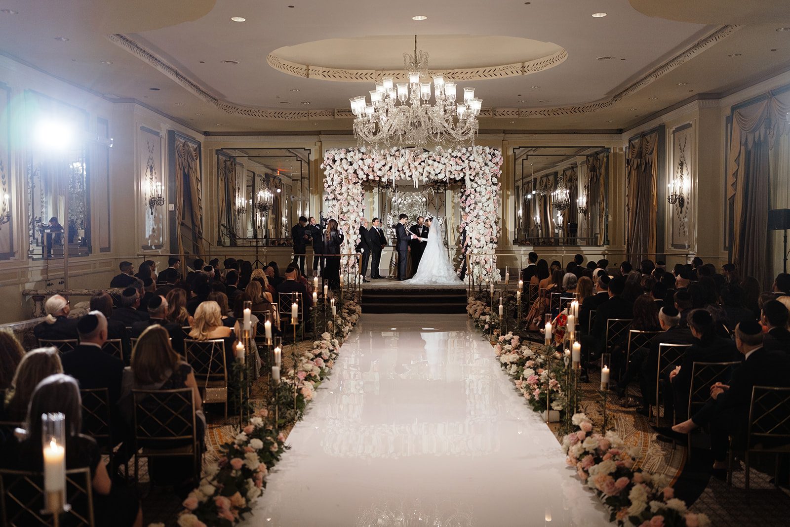 Dori and Ben under the chuppah, seen from behind