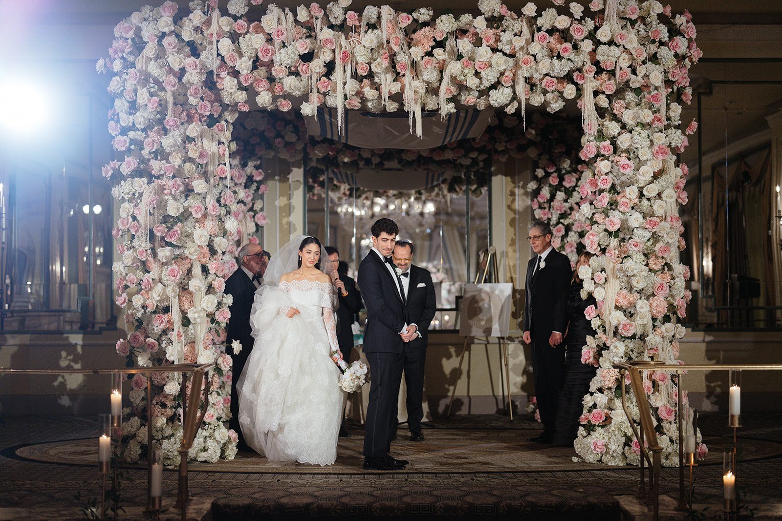 Dori and Ben under the chuppah with their parents