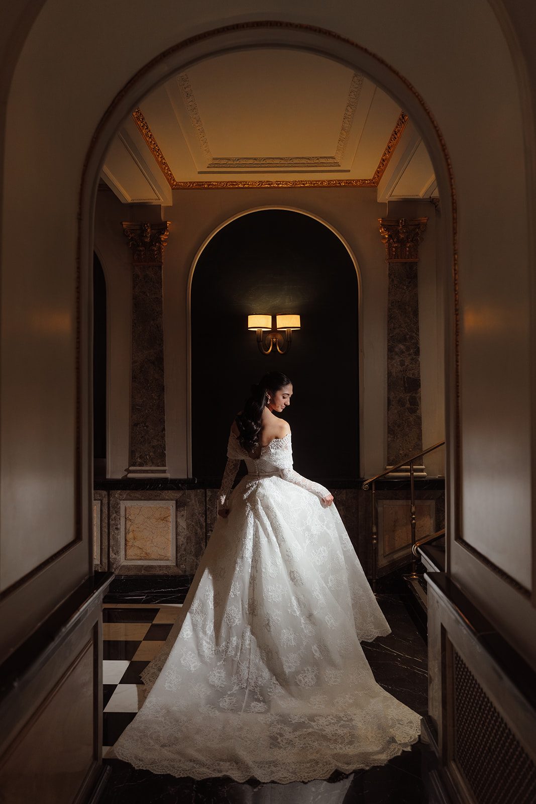 Dori in her gown in a corridor of The Pierre
