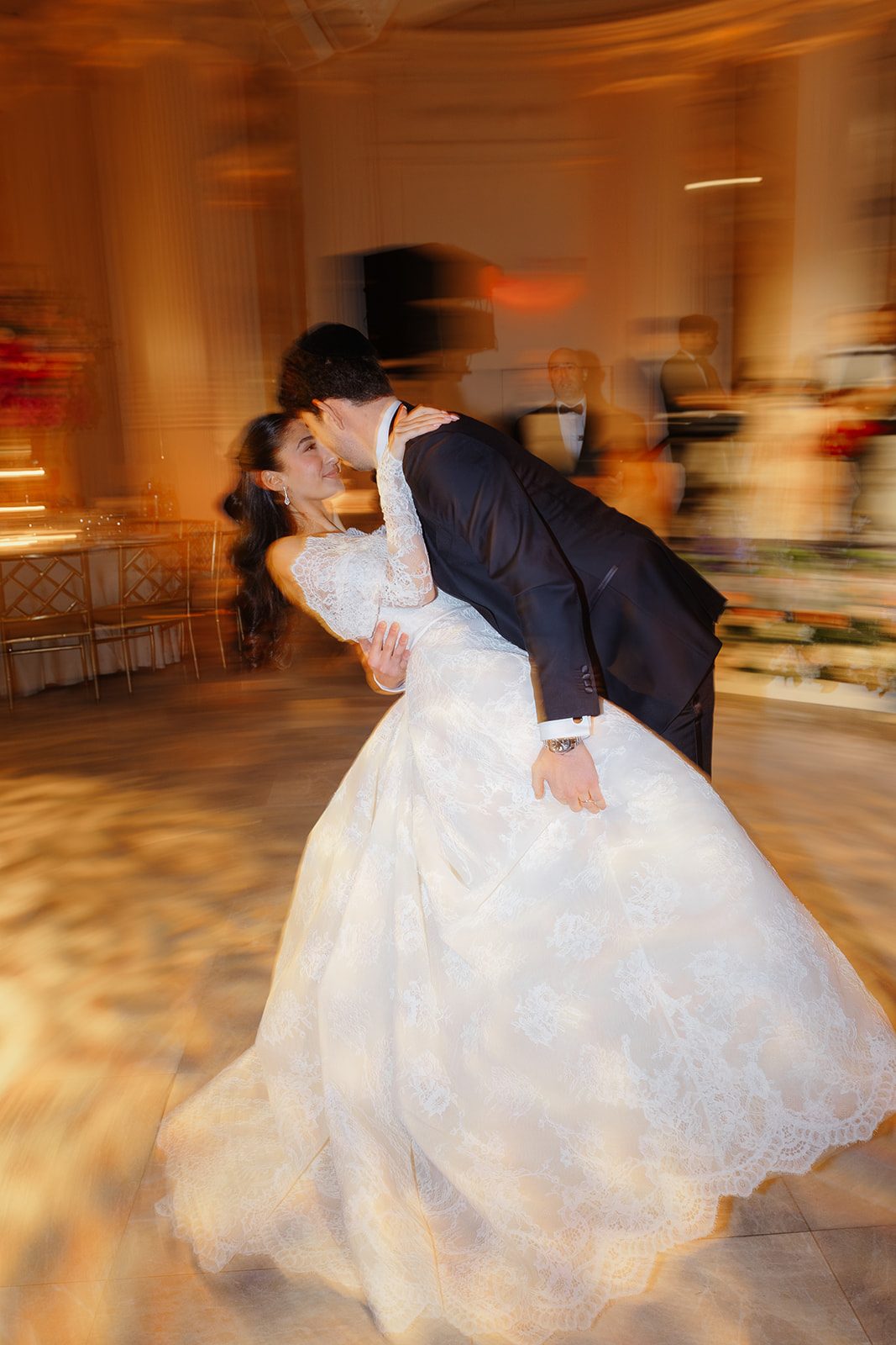Ben dips Dori on the dance floor